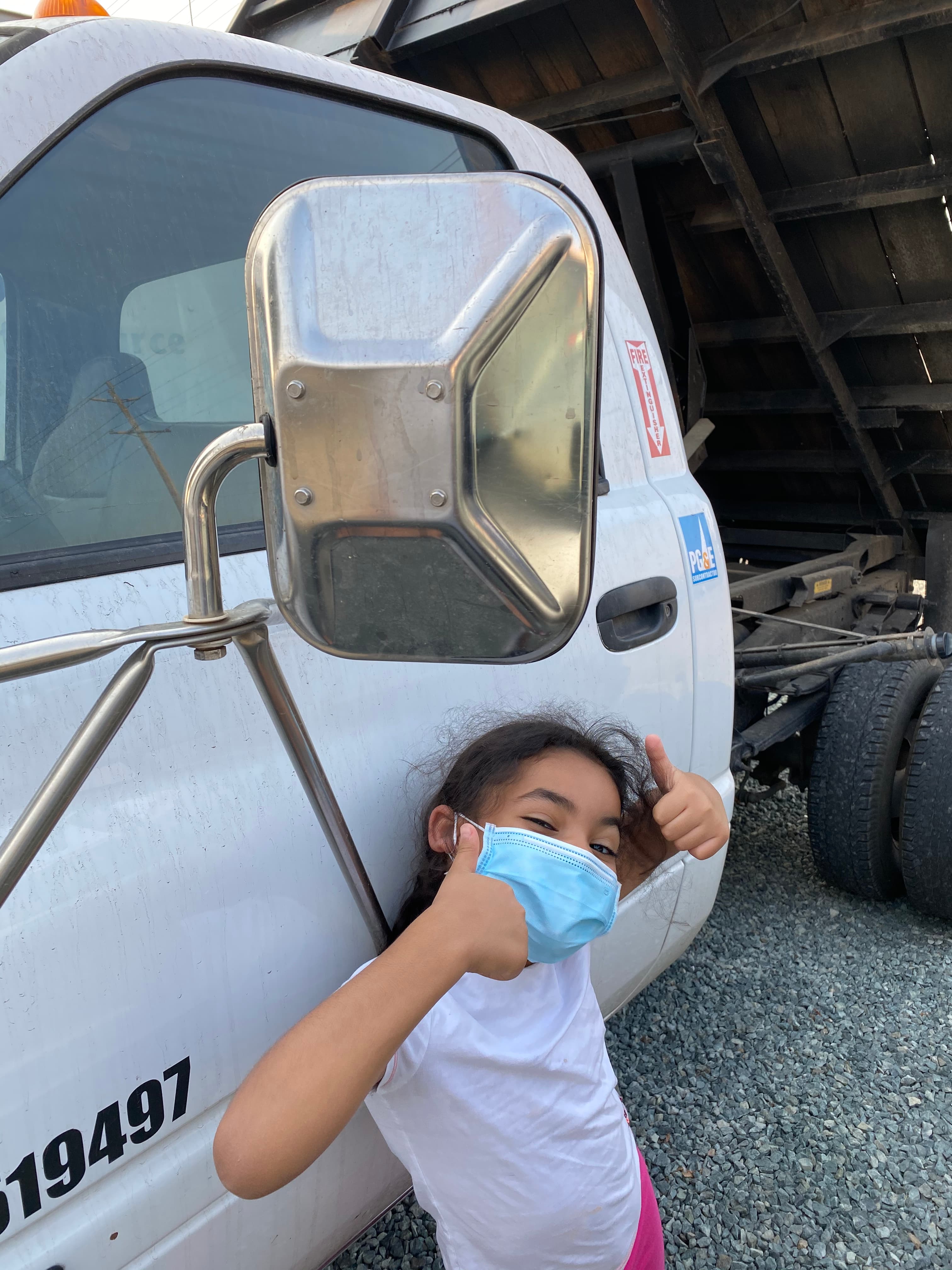 Servant King crew in front of branded truck